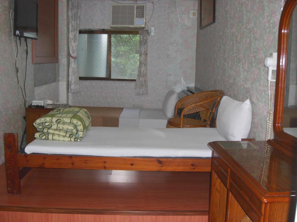 Postel nebo postele na pokoji v ubytování Uni Hotel