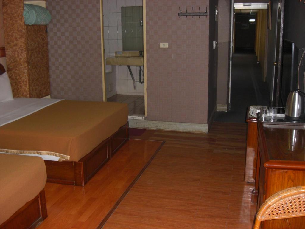 Postel nebo postele na pokoji v ubytování Uni Hotel