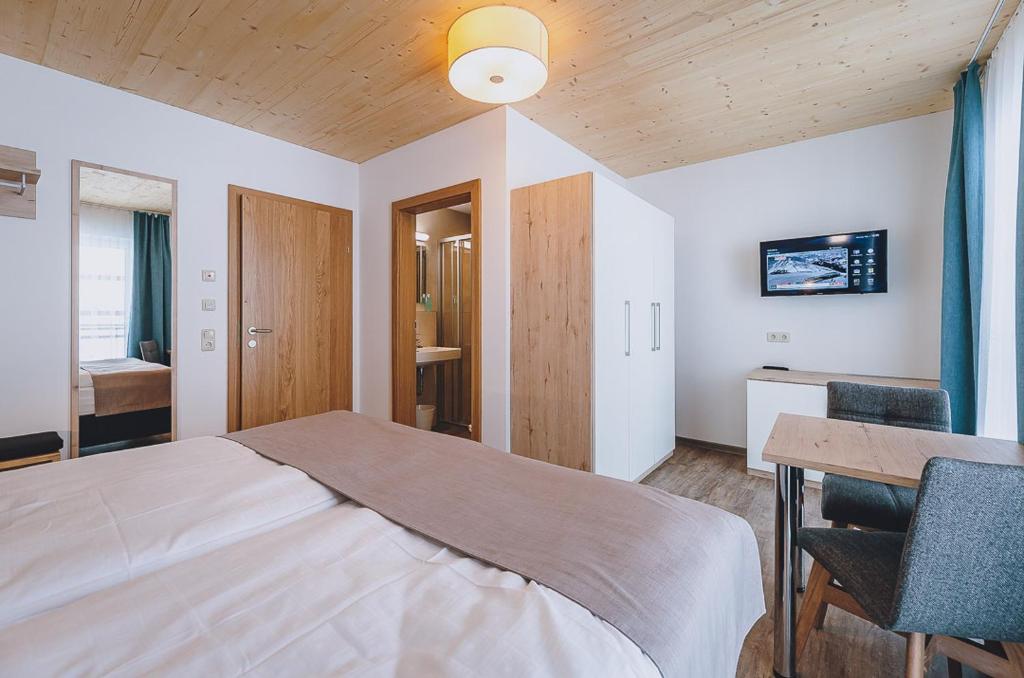 Postel nebo postele na pokoji v ubytování AlpenOase Sonnhof