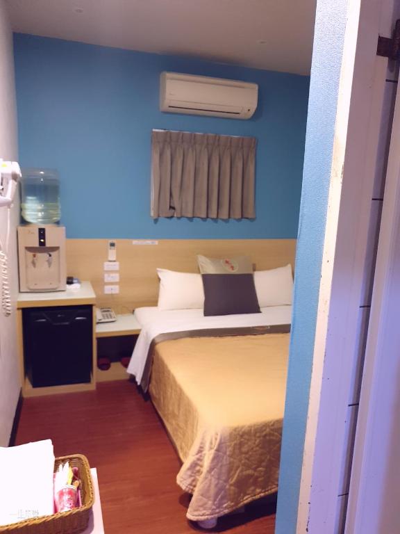 Postel nebo postele na pokoji v ubytování Yung Feng Hotel