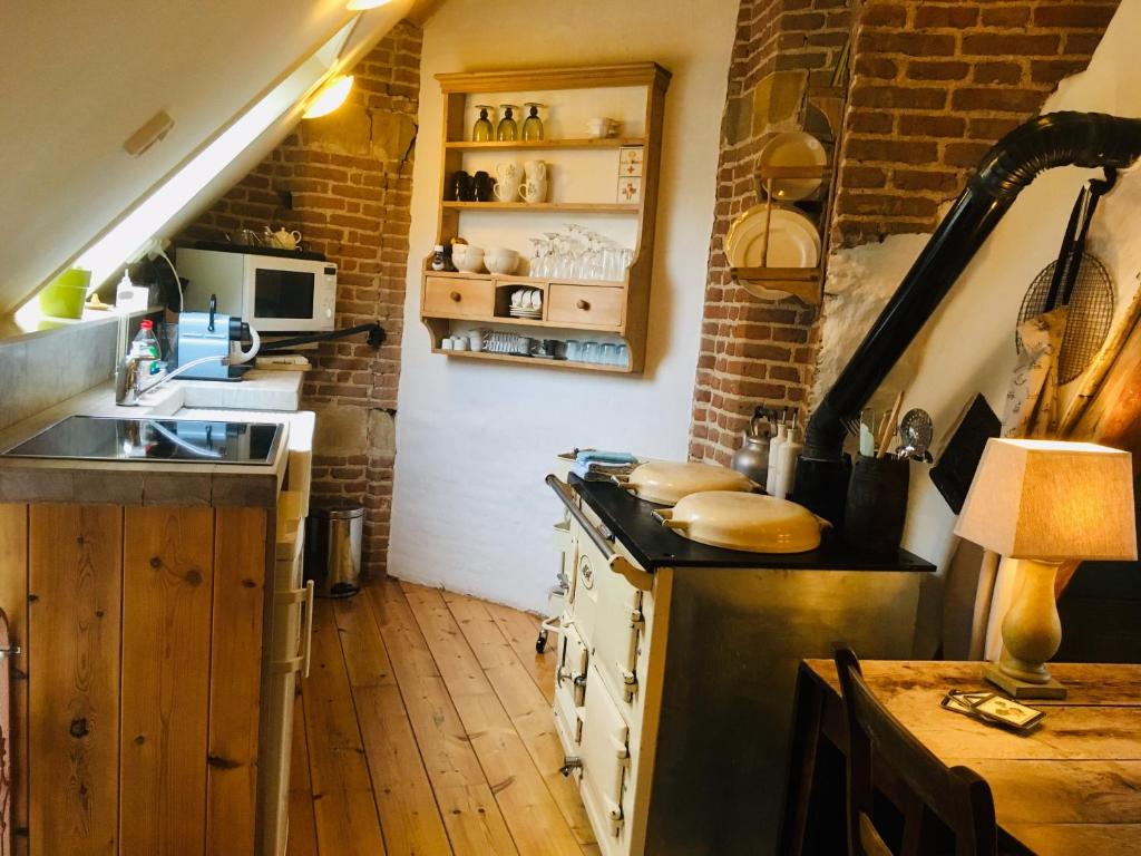 Kuchyň nebo kuchyňský kout v ubytování De Stadsboerderij