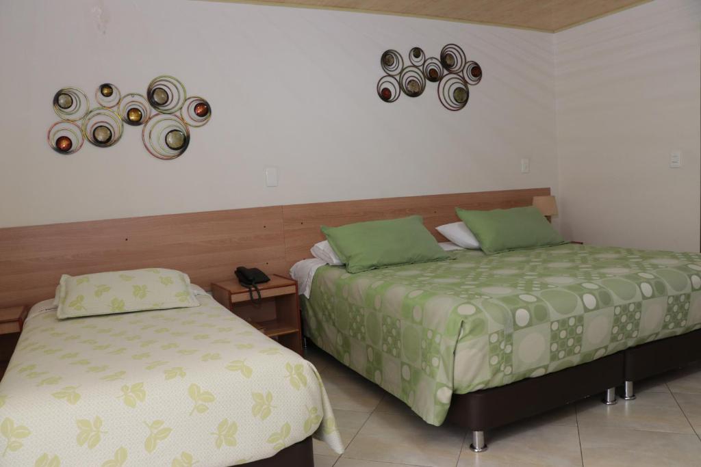 Postel nebo postele na pokoji v ubytování Hoteles Bogotá Inn Park Way