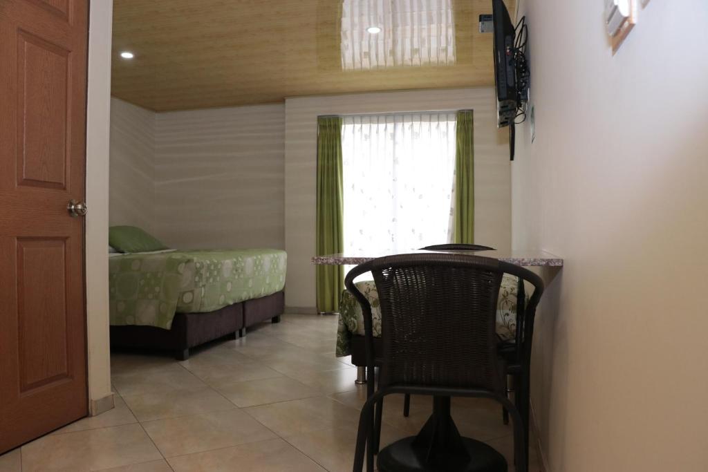 Postel nebo postele na pokoji v ubytování Hoteles Bogotá Inn Park Way