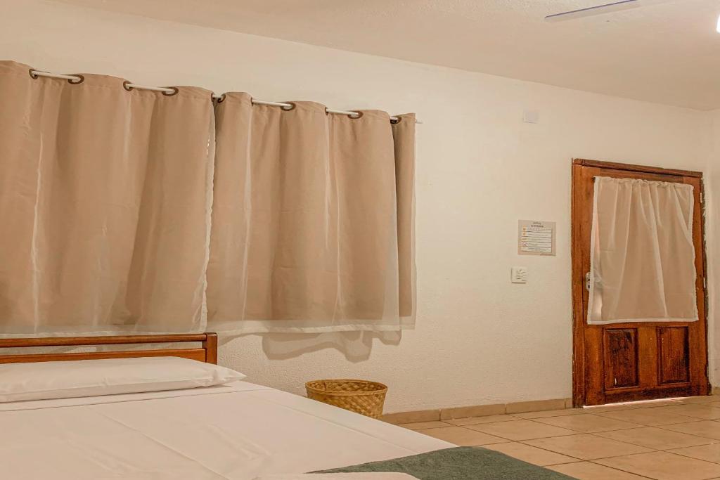 Postel nebo postele na pokoji v ubytování Pousada Migo