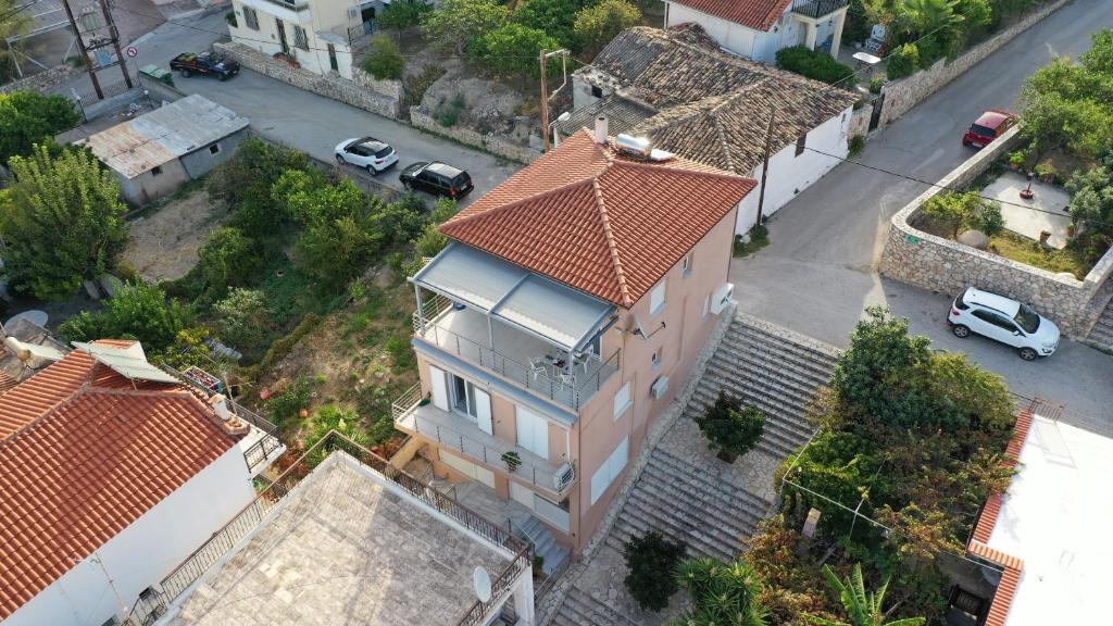 an overhead view of a house with an orange roof at Christina Apartment in Derveni