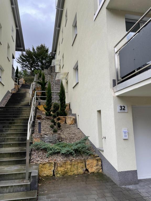 a set of stairs next to a building at Ferienwohnung mit Waldblick in Leimen