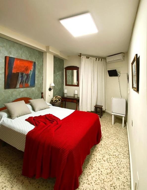Postel nebo postele na pokoji v ubytování Hostal Azahara