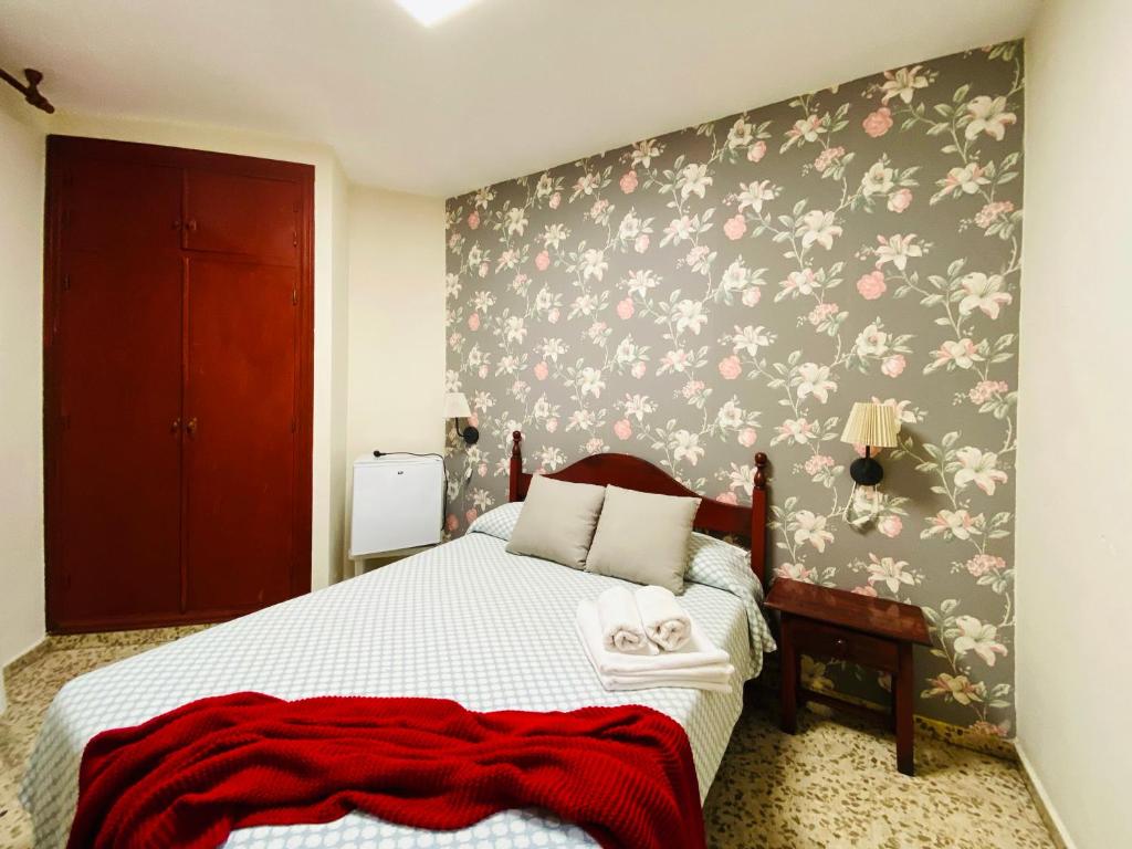 Postel nebo postele na pokoji v ubytování Hostal Azahara