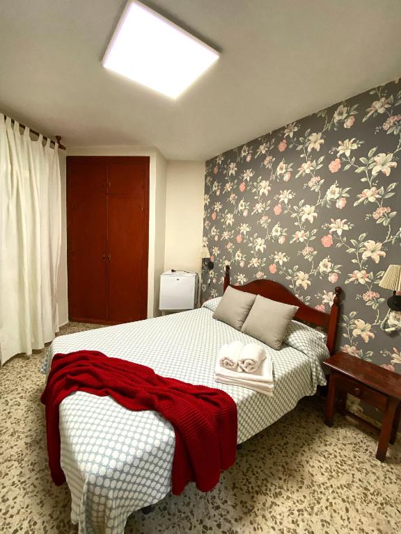 Postel nebo postele na pokoji v ubytování Hostal Azahara