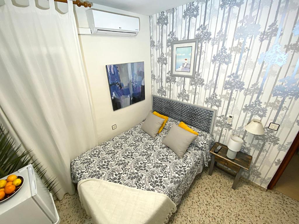 Postel nebo postele na pokoji v ubytování Hostal Azahara