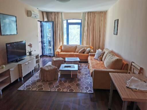 a living room with a couch and a tv at villa Bonita in Sunny Beach