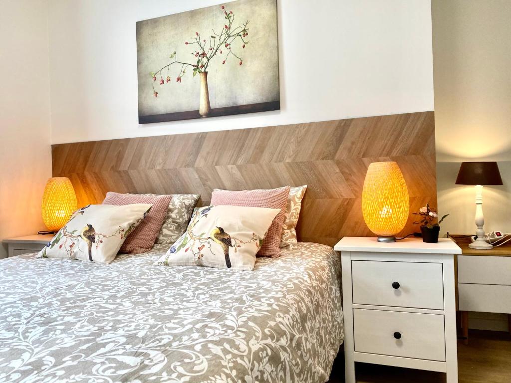 Ένα ή περισσότερα κρεβάτια σε δωμάτιο στο Сarnot Apartments ZOO Area