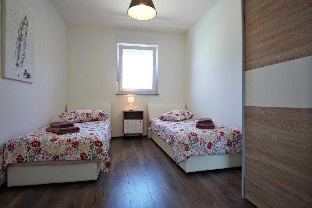 Posteľ alebo postele v izbe v ubytovaní Family house Hana
