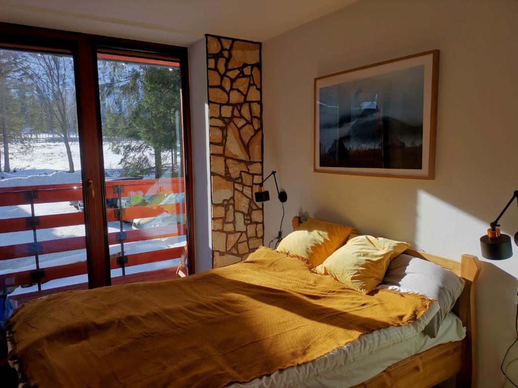 Posteľ alebo postele v izbe v ubytovaní Kościelisko Apartament Przy Dolince