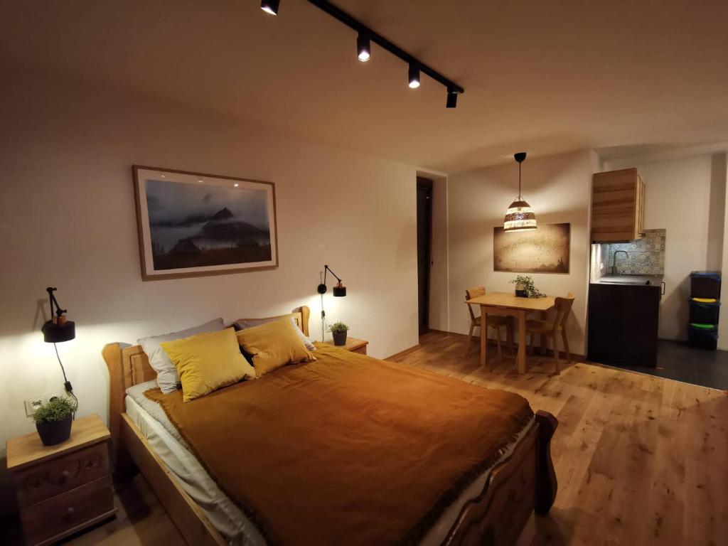 Posteľ alebo postele v izbe v ubytovaní Kościelisko Apartament Przy Dolince