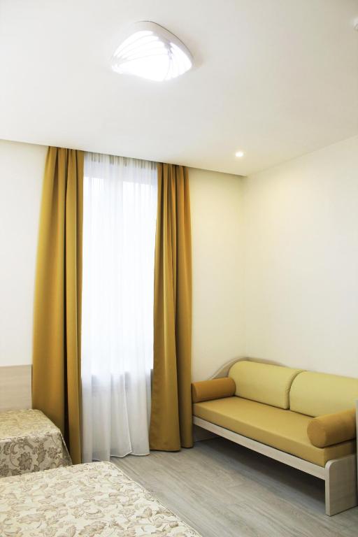 Postel nebo postele na pokoji v ubytování CSI Group - Hotel Metropoli