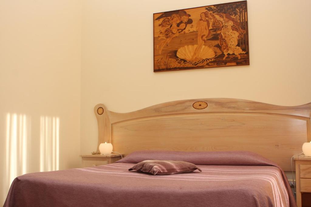 Postel nebo postele na pokoji v ubytování Divina House B&B