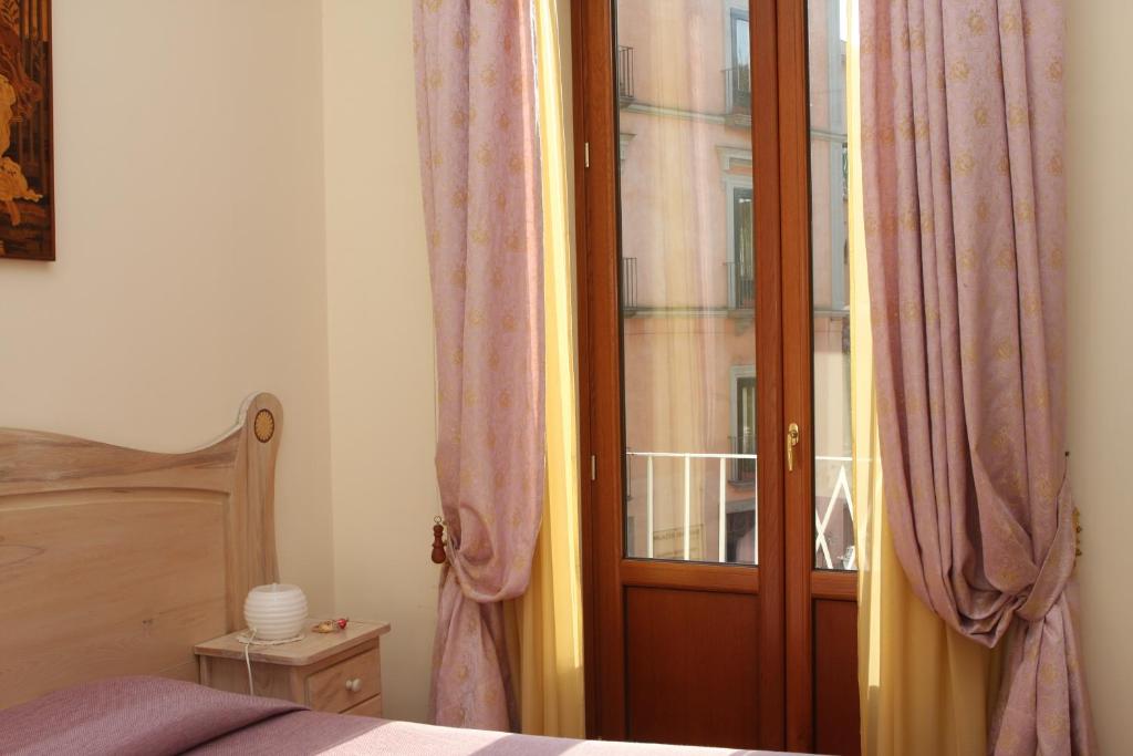 Postel nebo postele na pokoji v ubytování Divina House B&B