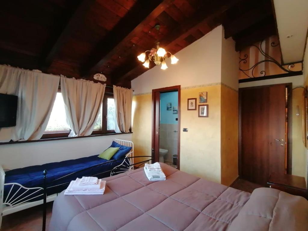 Postel nebo postele na pokoji v ubytování Il Castagneto