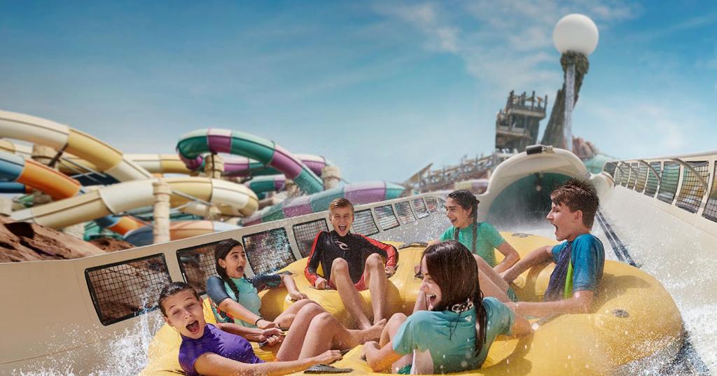 a group of people riding on a water slide on a cruise ship at Centro Yas Island-by Rotana in Abu Dhabi