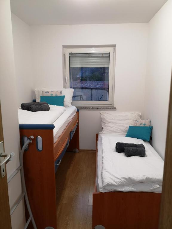 Postel nebo postele na pokoji v ubytování Apartma Apollonio
