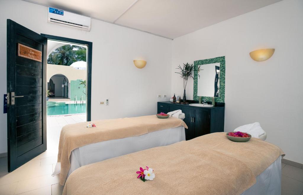 Кровать или кровати в номере TUI BLUE Bahari Zanzibar