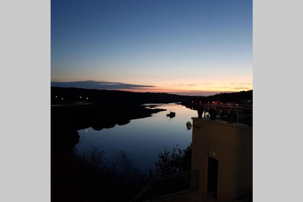 a view of a river at sunset at The Loft @ Clifden Bay Apartments in Clifden