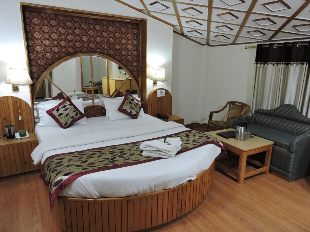 Postel nebo postele na pokoji v ubytování Hotel Chaman Palace