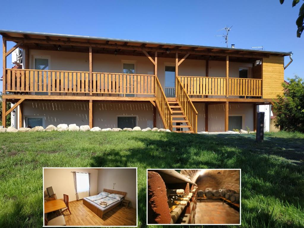 a large house with a deck and green grass at Penzion u Vinice in Sedlec