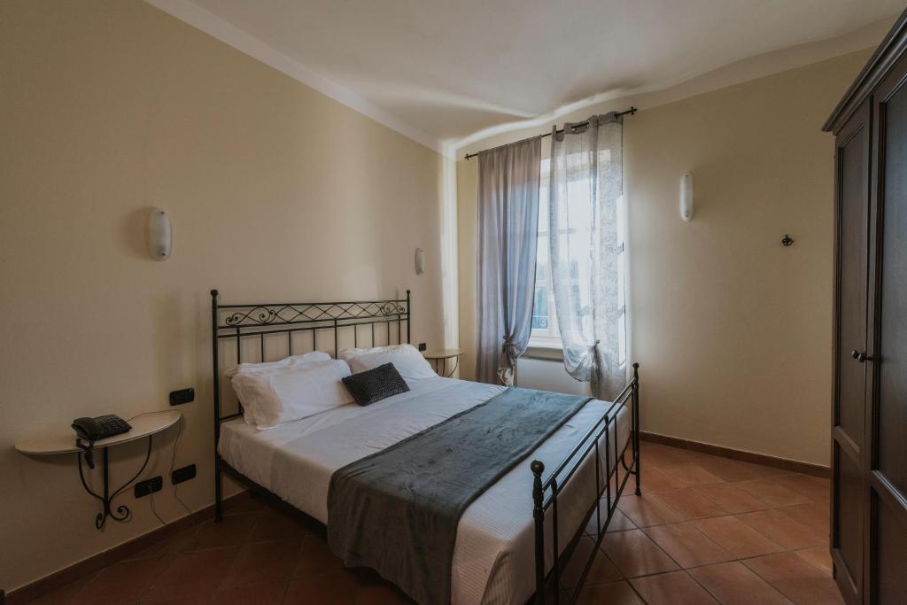 Postel nebo postele na pokoji v ubytování Il Castello di Bubbio