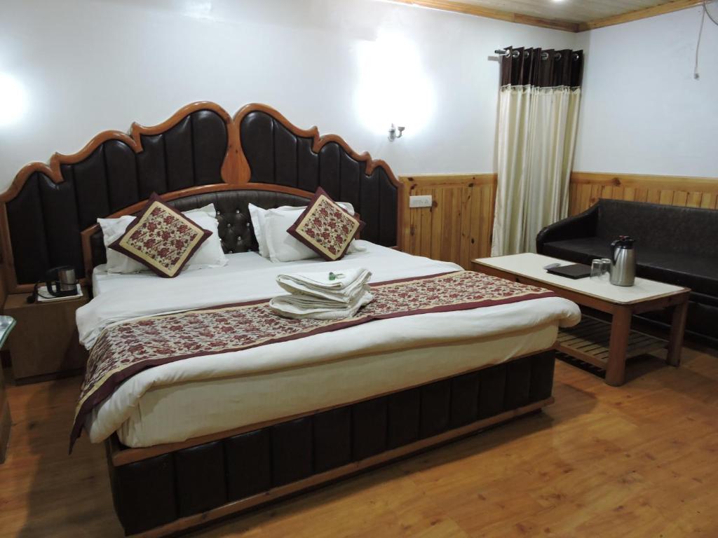 Postel nebo postele na pokoji v ubytování Hotel Chaman Palace