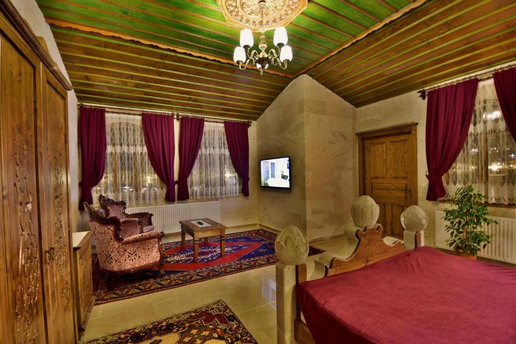 TV a/nebo společenská místnost v ubytování Stone House Cave Hotel