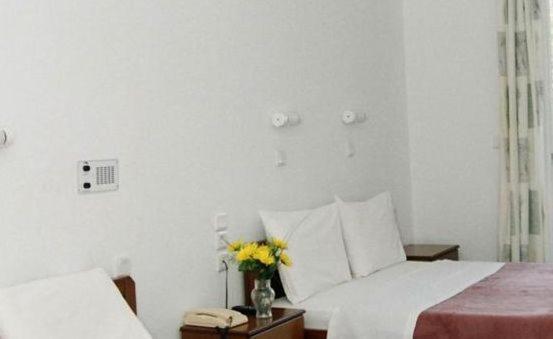 Postel nebo postele na pokoji v ubytování Melissa Hotel