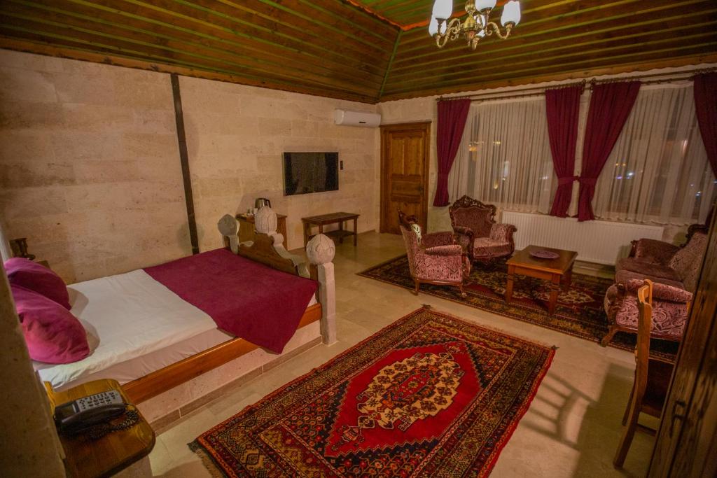 TV a/nebo společenská místnost v ubytování Stone House Cave Hotel