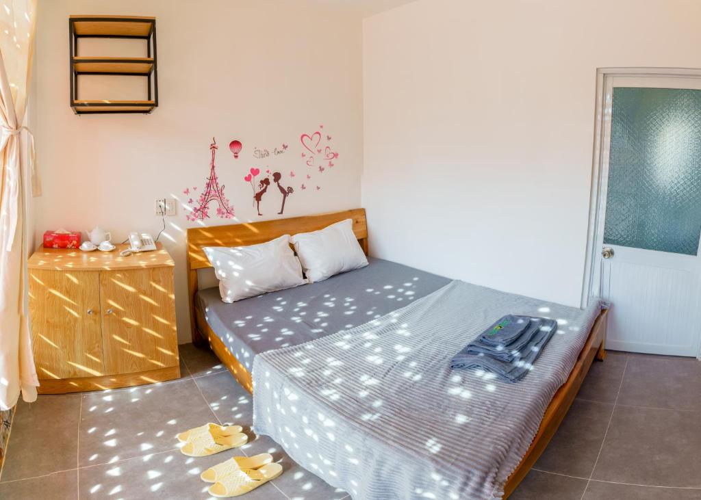 Postel nebo postele na pokoji v ubytování Mekong 69 Hostel