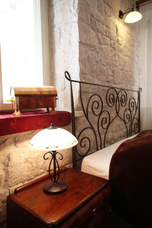 Posteľ alebo postele v izbe v ubytovaní Tragurium & Salona Apartments