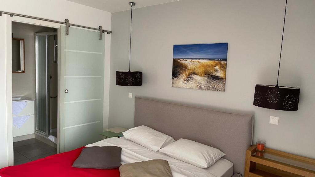Postel nebo postele na pokoji v ubytování Relais de l'Aérodrome