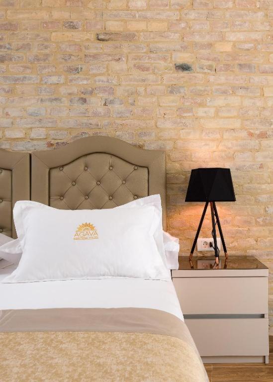 Postel nebo postele na pokoji v ubytování Agava Lux Rooms&Pool