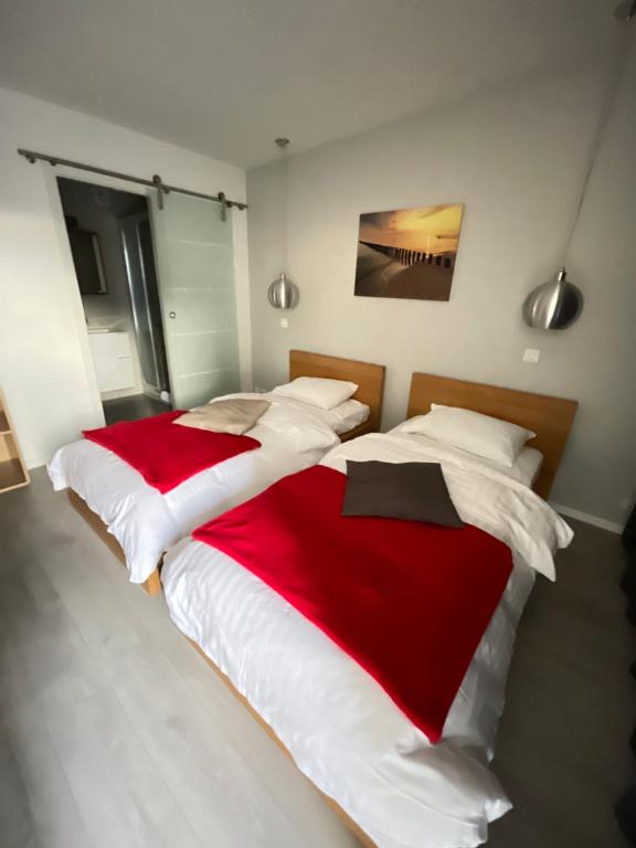 Postel nebo postele na pokoji v ubytování Relais de l'Aérodrome
