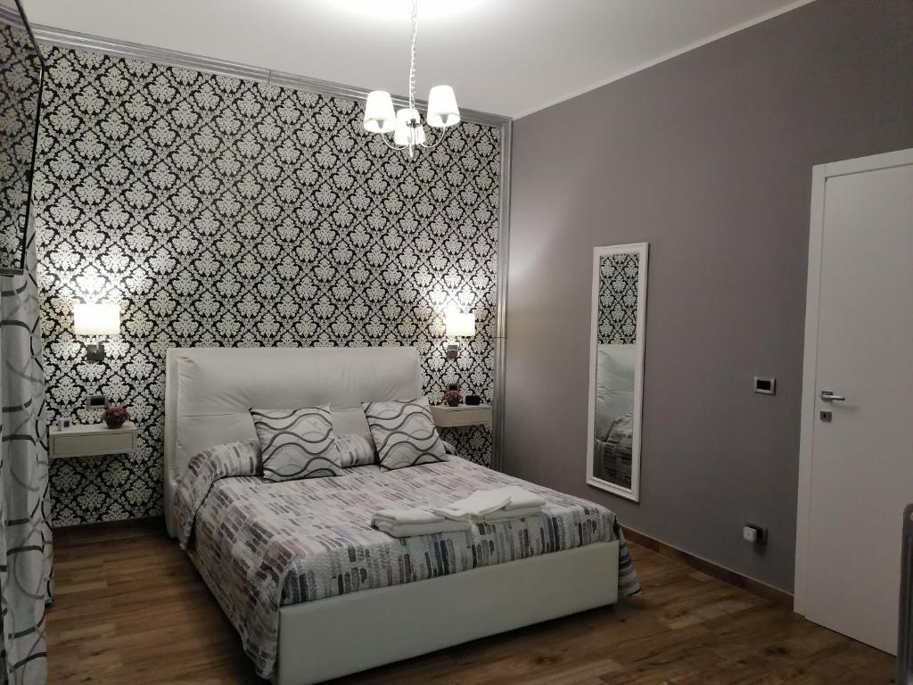 Postel nebo postele na pokoji v ubytování Home Syrakos B&B