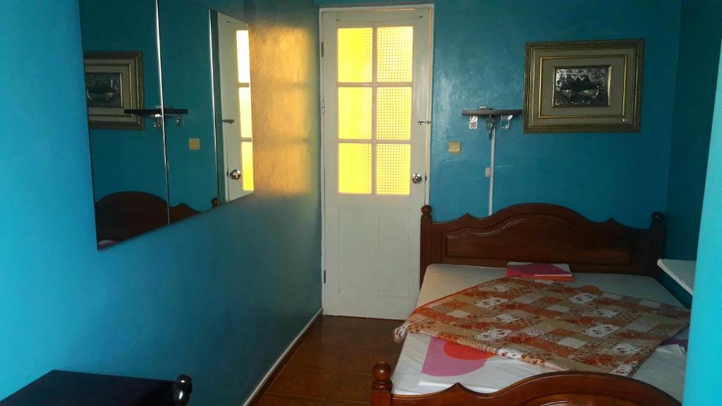 Postel nebo postele na pokoji v ubytování Los Cuartos Man Pretinha
