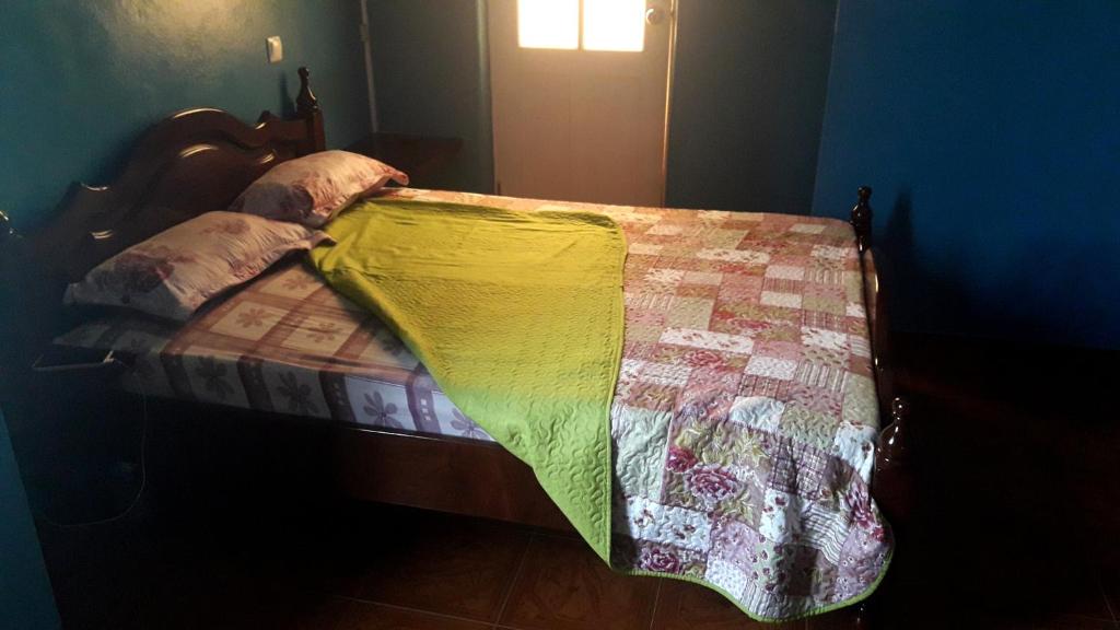 Postel nebo postele na pokoji v ubytování Los Cuartos Man Pretinha