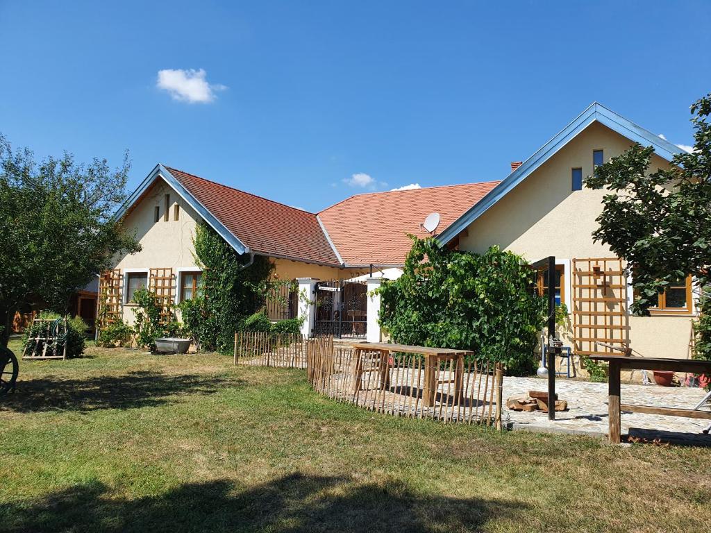 a house with a fence in front of it at Landhaus Steirerengel - Ferien &amp; Jagd in Lócs