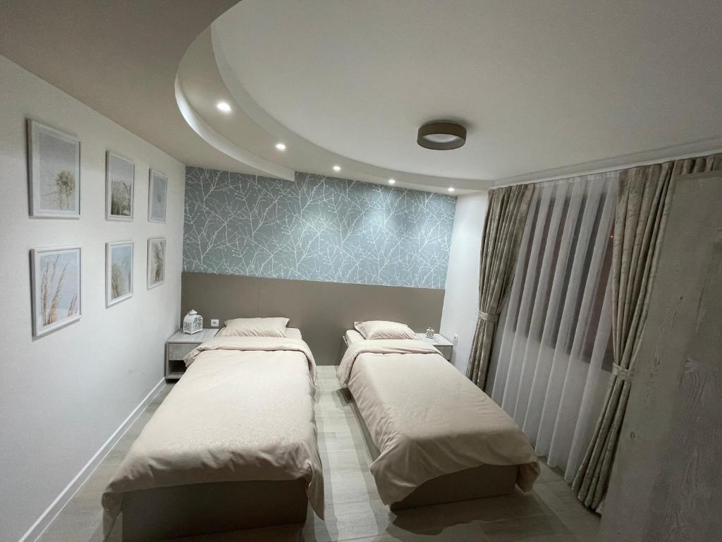 Postel nebo postele na pokoji v ubytování Apartmani Jović