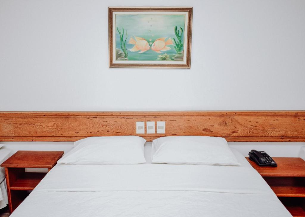 Postel nebo postele na pokoji v ubytování Poty Praia Hotel