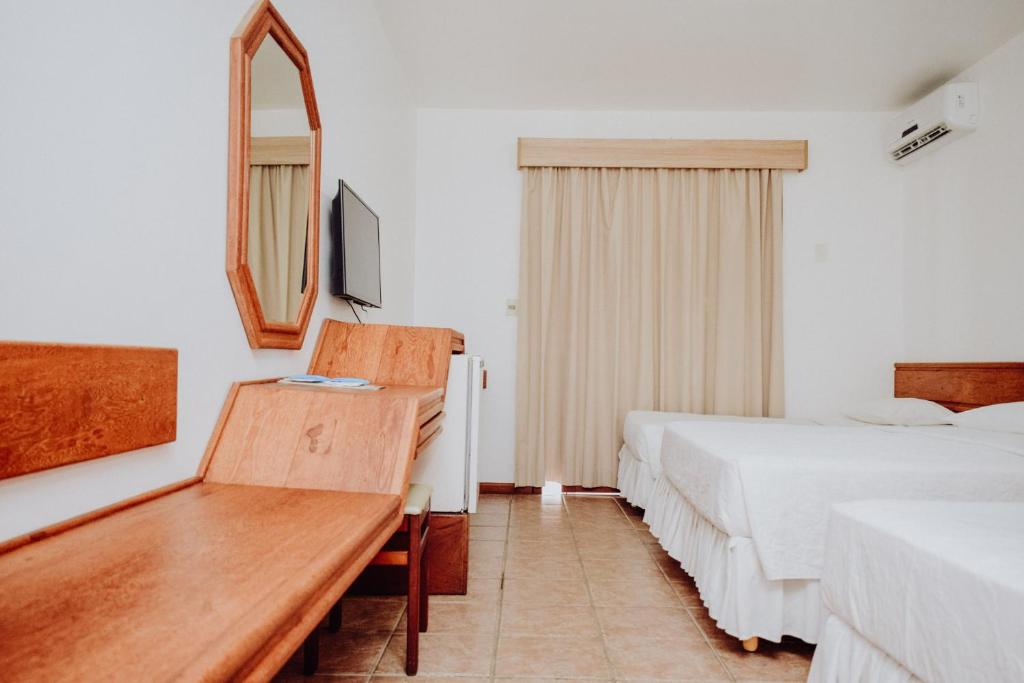 
Cama ou camas em um quarto em Poty Praia Hotel
