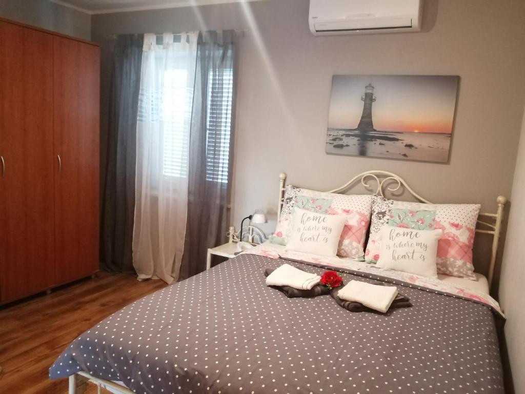 Postel nebo postele na pokoji v ubytování Apartments Sven-Marino
