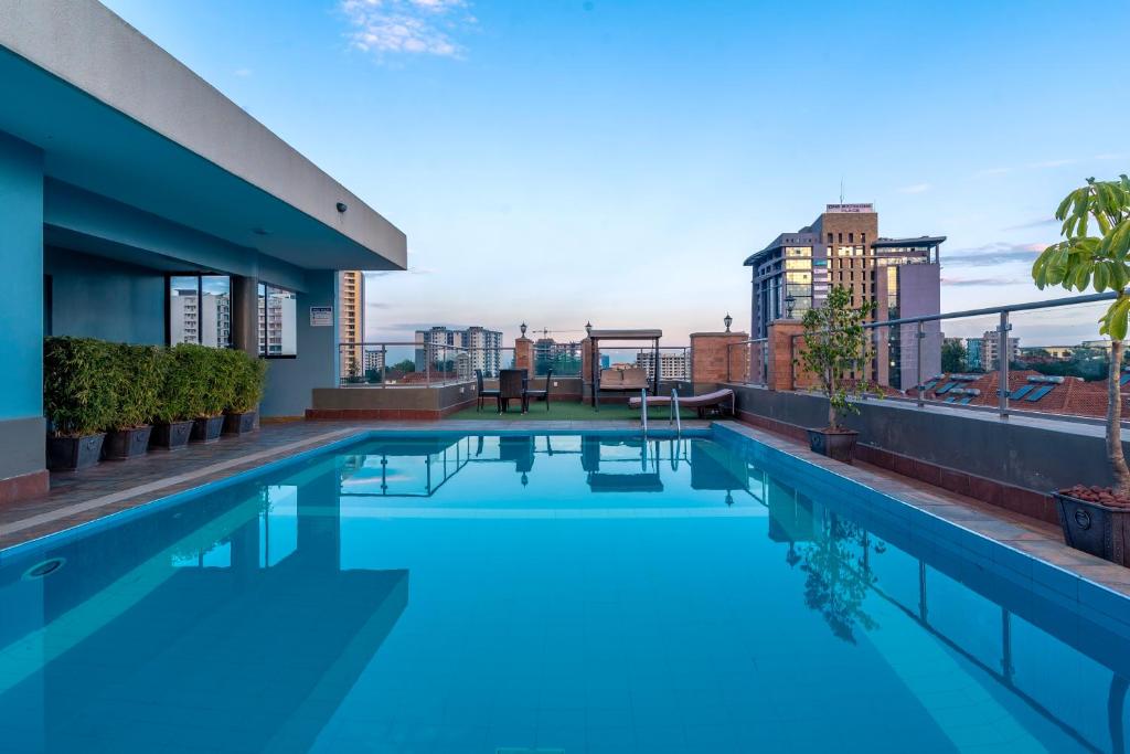a swimming pool on the roof of a building at Highlands Suites Hotel Apartments in Nairobi