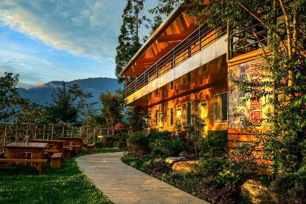 a building with a picnic table in front of it at Tianen Farm in Hualing