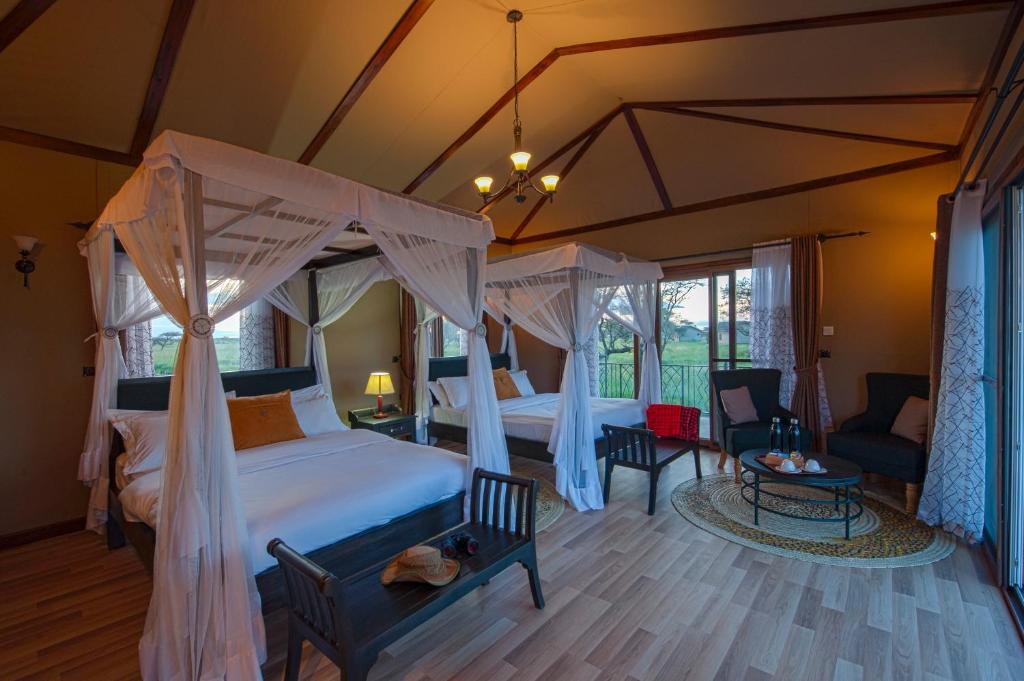 Postel nebo postele na pokoji v ubytování Serengeti Sametu Camp